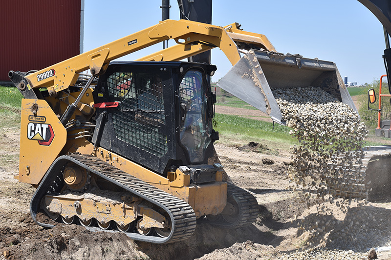 skid-steer-moving-dirt