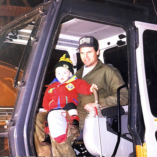 father-son-excavator-cab